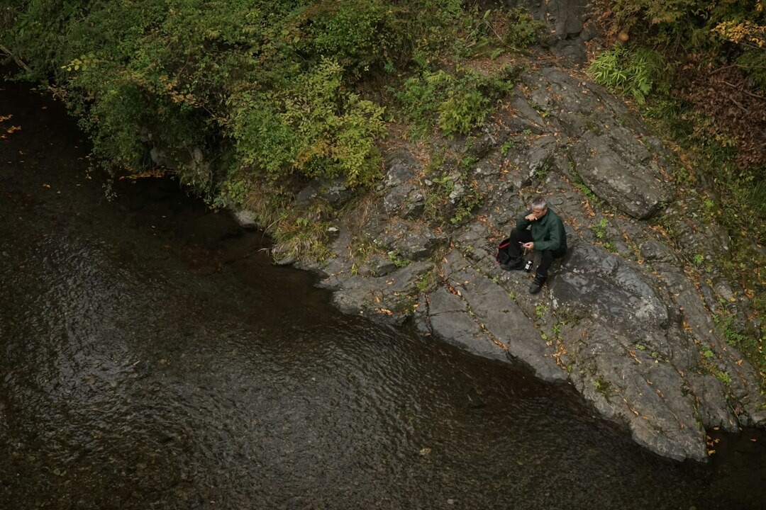 environmental inspector checking river